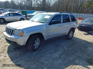 2010 Jeep Grand Cherokee Laredo with VIN 1J4PS4GK2AC155683, listed as a IAAI auction lot 41411133 with 211,803 mi miles. Bid and sale history available at carsss.com. Image 2.