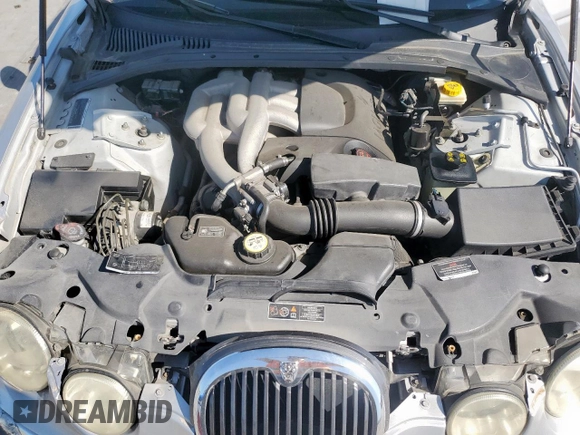 2003 Jaguar S-Type with VIN SAJEA01T43FM62477, listed as a Copart auction lot 52693085 with 109,761 mi miles and Salvage Title. Bid and sale history available at DreamBid. Image 11.