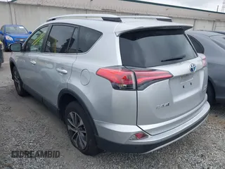 2016 Toyota RAV4 Hybrid XLE with VIN JTMRJREVXGD029019, listed as a IAAI auction lot 42021530 with 74,400 mi miles. Bid and sale history available at carsss.com. Image 3.