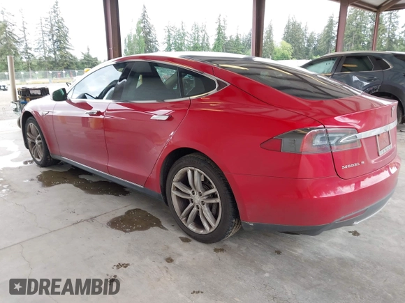 2013 Tesla Model S with VIN 5YJSA1CN7DFP26996, listed as a IAAI auction lot 42244540 with 128,160 mi miles and . Bid and sale history available at DreamBid. Image 3.