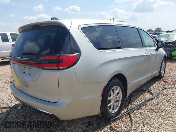 2023 Chrysler Pacifica Touring L with VIN 2C4RC1BG7PR521232, listed as a IAAI auction lot 42087909 with 34,609 mi miles and . Bid and sale history available at DreamBid. Image 4.
