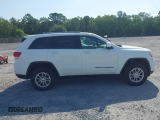 2020 Jeep Grand Cherokee Laredo E with VIN 1C4RJFAG1LC389026, listed as a IAAI auction lot 42261396 with 100,409 mi miles and . Bid and sale history available at DreamBid. Image 13.
