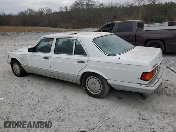1989 Mercedes-Benz 560 with VIN WDBCA39E0KA469417, listed as a Copart auction lot 43929215 with 52,559 mi miles and Salvage Title. Bid and sale history available at DreamBid. Image 2.