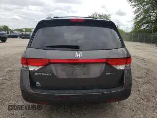2014 Honda Odyssey Touring with VIN 5FNRL5H90EB014360, listed as a Copart auction lot 56699845 with 180,913 mi miles and Salvage title. Bid and sale history available at DreamBid. Image 6.