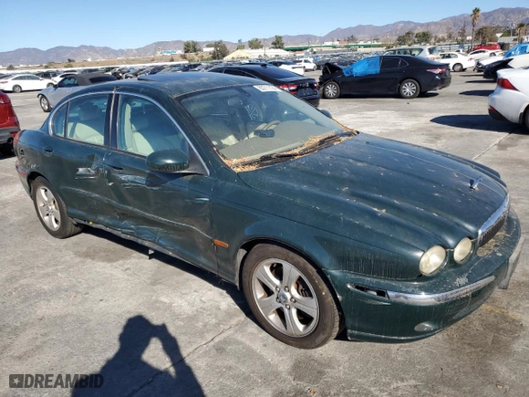 2002 Jaguar X-Type with VIN SAJEA51C12WC33477, listed as a Copart auction lot 83711124 with 165,637 mi miles and Salvage Title. Bid and sale history available at carsss.com. Image 4.