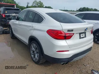 2015 BMW X4 xDrive28i with VIN 5UXXW3C51F0M86668, listed as a IAAI auction lot 42489071 with 59,694 mi miles and . Bid and sale history available at DreamBid. Image 3.