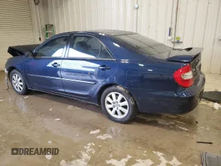 2003 Toyota Camry LE z VIN 4T1BF30K23U058761, wystawiony jako Copart lot #51286985 z przebiegiem 90 143 mil mil oraz Nie do naprawy • Non repairable. Historia ofert i sprzedaży dostępna na DreamBid. Obrazek 2.