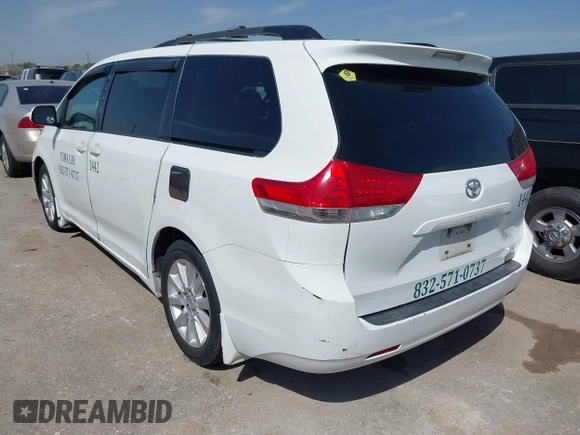2014 Toyota Sienna LE with VIN 5TDJK3DC5ES081232, listed as a IAAI auction lot 41789629 with 397,033 mi miles and . Bid and sale history available at DreamBid. Image 3.