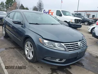 2014 Volkswagen CC R-Line with VIN WVWBP7AN0EE506090, listed as a IAAI auction lot 41752458 with 98,728 mi miles and . Bid and sale history available at DreamBid. Image 1.