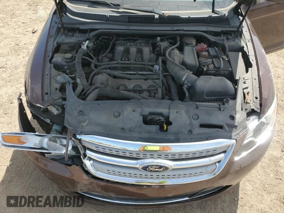 2012 Ford Taurus Limited z VIN 1FAHP2FW4CG112923, wystawiony jako Copart lot #56169085 z przebiegiem 142 687 mil mil oraz Szkoda całkowita • Salvage title. Historia ofert i sprzedaży dostępna na DreamBid. Obrazek 11.