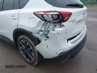 2016 Mazda CX-5 Grand Touring z VIN JM3KE4DY0G0705884, wystawiony jako IAAI lot #42016910 z przebiegiem 73 324 mil mil oraz . Historia ofert i sprzedaży dostępna na DreamBid. Obrazek 6.