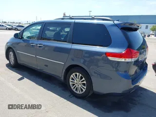 2014 Toyota Sienna XLE with VIN 5TDYK3DC5ES447155, listed as a IAAI auction lot 42003951 with 60,064 mi miles and . Bid and sale history available at DreamBid. Image 3.