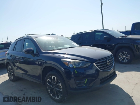 2016 Mazda CX-5 Grand Touring z VIN JM3KE2DY3G0797321, wystawiony jako IAAI lot #42017174 z przebiegiem 65 505 mil mil oraz . Historia ofert i sprzedaży dostępna na DreamBid. Obrazek 13.