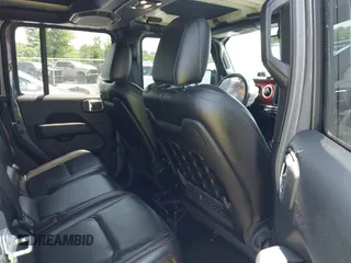 2021 Jeep Gladiator Rubicon with VIN 1C6JJTBG2ML515932, listed as a IAAI auction lot 42471704 with 57,775 mi miles and . Bid and sale history available at DreamBid. Image 8.