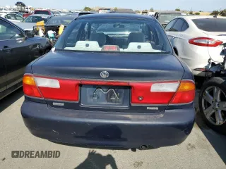 1997 Mazda Protege DX z VIN JM1BC1412V0157268, wystawiony jako Copart lot #61380564 z przebiegiem 85 356 mil mil oraz Szkoda całkowita • Salvage title. Historia ofert i sprzedaży dostępna na DreamBid. Obrazek 6.