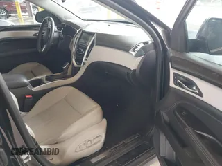 2014 Cadillac SRX Luxury Collection z VIN 3GYFNEE36ES677883, wystawiony jako IAAI lot #42260861 z przebiegiem 51 730 mil mil oraz . Historia ofert i sprzedaży dostępna na DreamBid. Obrazek 5.