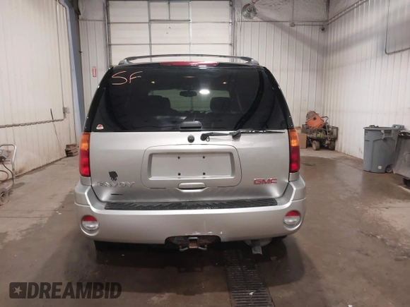 2004 GMC Envoy SLE with VIN 1GKDT13S042243883, listed as a IAAI auction lot 41795335 with 162,873 mi miles. Bid and sale history available at carsss.com. Image 16.