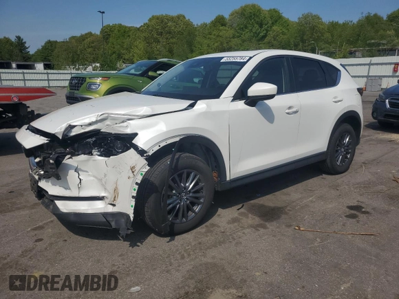 2021 Mazda CX-5 Touring with VIN JM3KFBCM7M0386995, listed as a Copart auction lot 55255784 with 43,561 mi miles and Salvage Title. Bid and sale history available at carsss.com. Image 1.