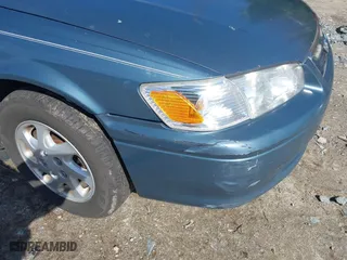 2000 Toyota Camry CE with VIN 4T1BG22KXYU730531, listed as a IAAI auction lot 42003342 with 248,235 mi miles. Bid and sale history available at carsss.com. Image 6.