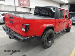 2022 Jeep Gladiator Altitude z VIN 1C6HJTAGXNL117353, wystawiony jako IAAI lot #42427921 z przebiegiem 28 801 mil mil oraz . Historia ofert i sprzedaży dostępna na DreamBid. Obrazek 4.