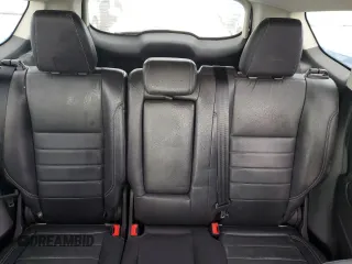 2016 Ford Escape SE z VIN 1FMCU0G91GUC59990, wystawiony jako Copart lot #56956395 z przebiegiem 112 706 mil mil oraz Szkoda całkowita • Salvage title. Historia ofert i sprzedaży dostępna na DreamBid. Obrazek 10.