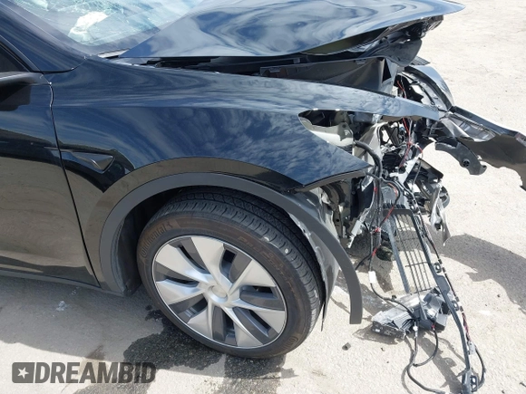 2023 Tesla Model Y Long Range z VIN 7SAYGDEE2PF863200, wystawiony jako IAAI lot #41805168 z przebiegiem 25 480 mil mil oraz . Historia ofert i sprzedaży dostępna na DreamBid. Obrazek 22.