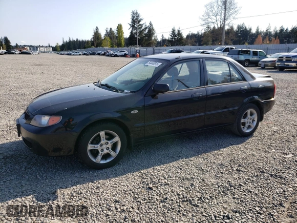 2003 Mazda Protege DX with VIN JM1BJ226231214537, listed as a Copart auction lot 54448615 with 147,753 mi miles and Salvage Title. Bid and sale history available at DreamBid. Image 1.