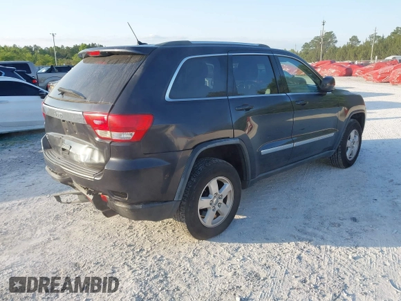 2012 Jeep Grand Cherokee Laredo with VIN 1C4RJFAG5CC234382, listed as a IAAI auction lot 42010153 with 185,078 mi miles. Bid and sale history available at carsss.com. Image 4.