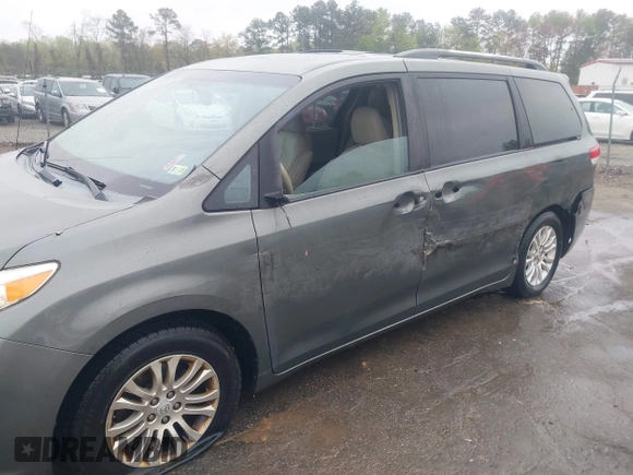 2013 Toyota Sienna XLE AAS with VIN 5TDYK3DC8DS401561, listed as a IAAI auction lot 41990044 with 214,111 mi miles and . Bid and sale history available at DreamBid. Image 6.