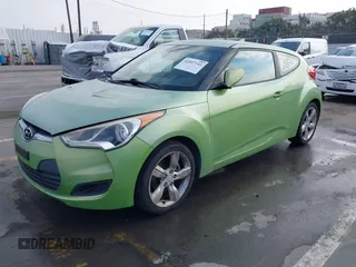 2012 Hyundai Veloster w/Gray Int z VIN KMHTC6AD3CU025315, wystawiony jako IAAI lot #42097741 z przebiegiem 146 726 mil mil oraz . Historia ofert i sprzedaży dostępna na DreamBid. Obrazek 2.