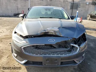2020 Ford Fusion Plug-In Hybrid Titanium with VIN 3FA6P0SU5LR230939, listed as a Copart auction lot 77899134 with 104,656 mi miles and Salvage Title. Bid and sale history available at carsss.com. Image 5.
