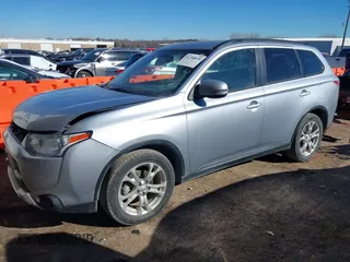 2015 Mitsubishi Outlander SE with VIN JA4AD3A34FZ011259, listed as a IAAI auction lot 41290830 with 88,147 mi miles and . Bid and sale history available at DreamBid. Image 2.