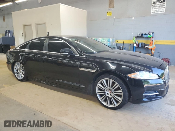 2015 Jaguar XJ with VIN SAJWJ1CD9F8V83885, listed as a Copart auction lot 65625135 with 81,794 mi miles and Clean title. Bid and sale history available at DreamBid. Image 4.