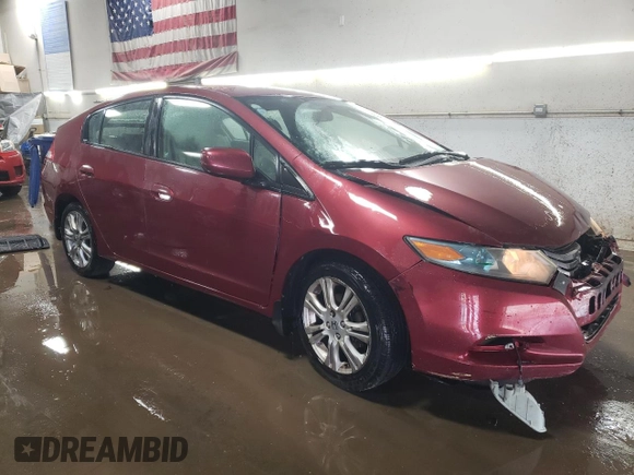 2010 Honda Insight LX with VIN JHMZE2H52AS034613, listed as a Copart auction lot 52701795 with 232,541 mi miles and Salvage Title. Bid and sale history available at DreamBid. Image 4.