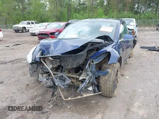 2019 Tesla Model 3 Mid Range z VIN 5YJ3E1EAXKF332974, wystawiony jako IAAI lot #41921722 z przebiegiem Nie podano mil oraz . Historia ofert i sprzedaży dostępna na DreamBid. Obrazek 6.