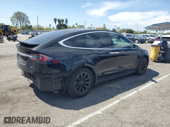 2017 Tesla Model X 90D with VIN 5YJXCBE20HF051099, listed as a Copart auction lot 52208205 with 118,828 mi miles and Salvage Title. Bid and sale history available at DreamBid. Image 3.