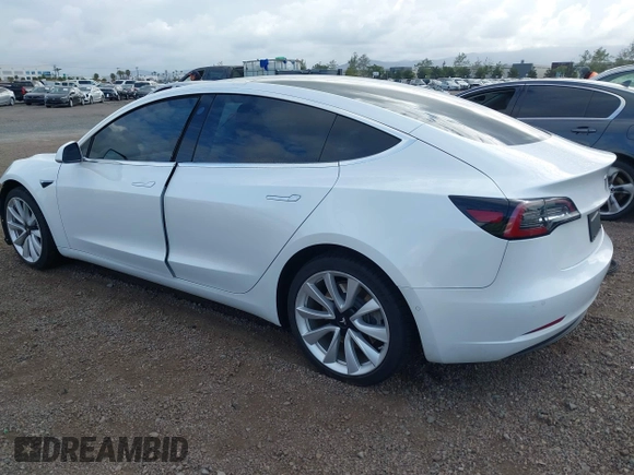 2019 Tesla Model 3 Long Range with VIN 5YJ3E1EBXKF512710, listed as a IAAI auction lot 42063737 with 90,721 mi miles and . Bid and sale history available at DreamBid. Image 3.