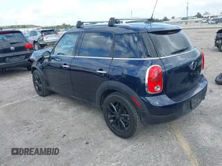 2013 MINI Countryman with VIN WMWZB3C58DWM07817, listed as a IAAI auction lot 41962291 with 60,763 mi miles and . Bid and sale history available at DreamBid. Image 3.
