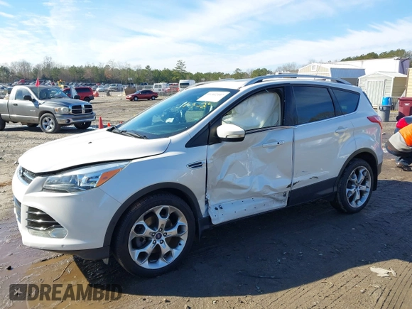 2014 Ford Escape Titanium with VIN 1FMCU9JX7EUD17335, listed as a IAAI auction lot 41302107 with 104,352 mi miles and . Bid and sale history available at DreamBid. Image 6.