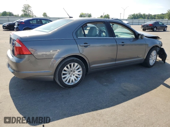 2010 Ford Fusion Hybrid z VIN 3FADP0L33AR267806, wystawiony jako Copart lot #55952815 z przebiegiem 146 912 mil mil oraz Szkoda całkowita • Salvage title. Historia ofert i sprzedaży dostępna na DreamBid. Obrazek 3.