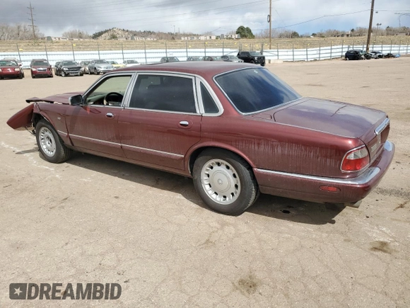 1998 Jaguar XJ Vanden Plas with VIN SAJKX6245WC830912, listed as a Copart auction lot 49717285 with 127,509 mi miles and Salvage Title. Bid and sale history available at DreamBid. Image 2.