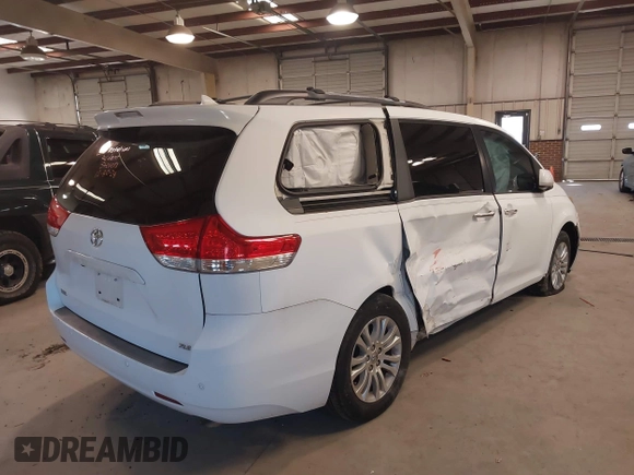 2011 Toyota Sienna XLE AAS with VIN 5TDYK3DC5BS130066, listed as a IAAI auction lot 41294340 with 156,591 mi miles and . Bid and sale history available at DreamBid. Image 4.