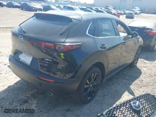 2024 Mazda CX-30 2.5 S Select Sport with VIN 3MVDMBBM8RM657137, listed as a IAAI auction lot 42030251 with 26,415 mi miles. Bid and sale history available at carsss.com. Image 4.