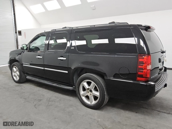 2013 Chevrolet Suburban LTZ with VIN 1GNSKKE79DR371333, listed as a Copart auction lot 74394354 with 165,171 mi miles and Clean Title. Bid and sale history available at carsss.com. Image 2.