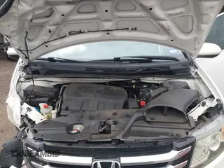 2014 Honda Odyssey Touring with VIN 5FNRL5H95EB059729, listed as a IAAI auction lot 42148110 with 135,304 mi miles and . Bid and sale history available at DreamBid. Image 10.