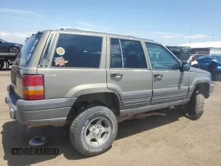 1997 Jeep Grand Cherokee Laredo z VIN 1J4GZ58S6VC636803, wystawiony jako Copart lot #59977115 z przebiegiem Nie podano mil oraz Szkoda całkowita • Salvage title. Historia ofert i sprzedaży dostępna na DreamBid. Obrazek 3.
