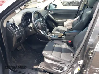 2016 Mazda CX-5 Grand Touring z VIN JM3KE4DY1G0893119, wystawiony jako IAAI lot #42049614 z przebiegiem 102 506 mil mil oraz . Historia ofert i sprzedaży dostępna na DreamBid. Obrazek 5.