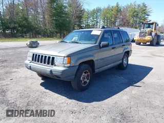 1997 Jeep Grand Cherokee Laredo with VIN 1J4GZ58S7VC713517, listed as a IAAI auction lot 42062214 with 205,533 mi miles. Bid and sale history available at carsss.com. Image 2.