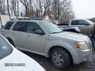 2009 Mercury Mariner z VIN 4M2CU91709KJ24606, wystawiony jako IAAI lot #41411160 z przebiegiem Nie podano mil oraz . Historia ofert i sprzedaży dostępna na DreamBid. Obrazek 13.