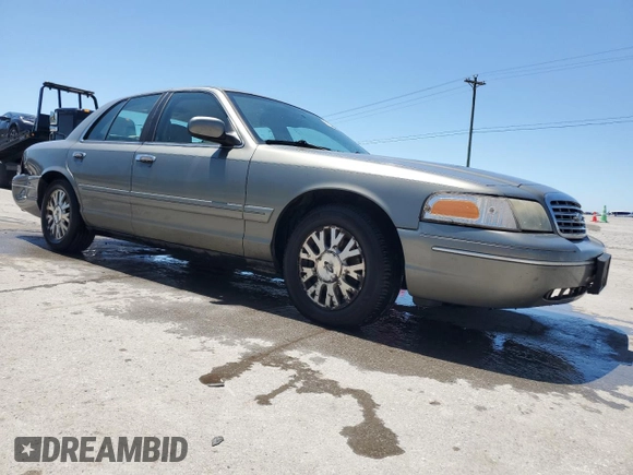 2003 Ford Crown Victoria LX z VIN 2FAFP74W43X123583, wystawiony jako Copart lot #57677555 z przebiegiem 185 336 mil mil oraz Szkoda całkowita • Salvage title. Historia ofert i sprzedaży dostępna na DreamBid. Obrazek 4.